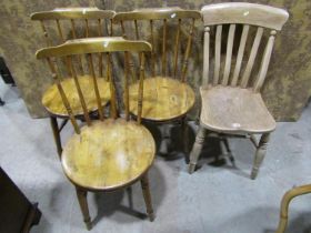 Three Swedish stick back kitchen chairs with circular seats and a single Windsor lathe back chair (