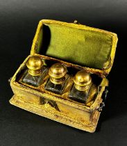 An 18th century velvet and brass mounted casket containing three cut glass scent bottles By family