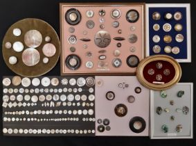 A collection of Mother of Pearl buttons including some finely worked examples with metal frames,