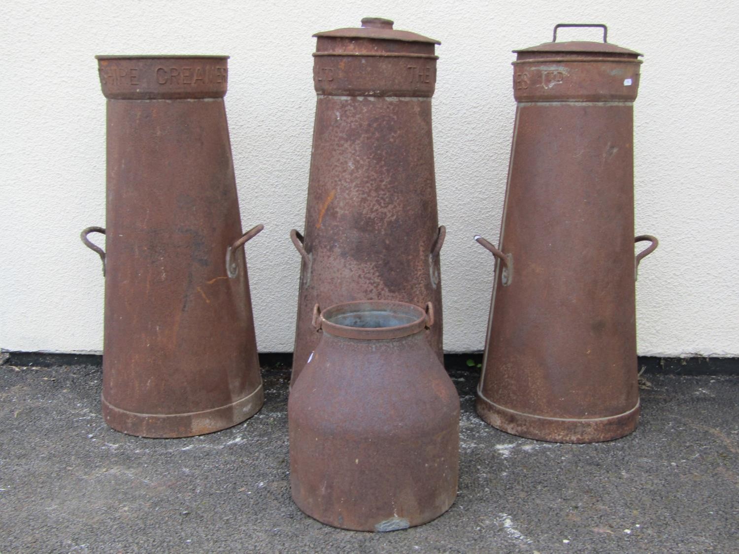 Three old galvanised ex Wiltshire Creameries Ltd milk churns of tapered cylindrical form with