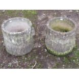A pair of weathered cast composition stone garden planters in the form of tree stumps, 29cm high,