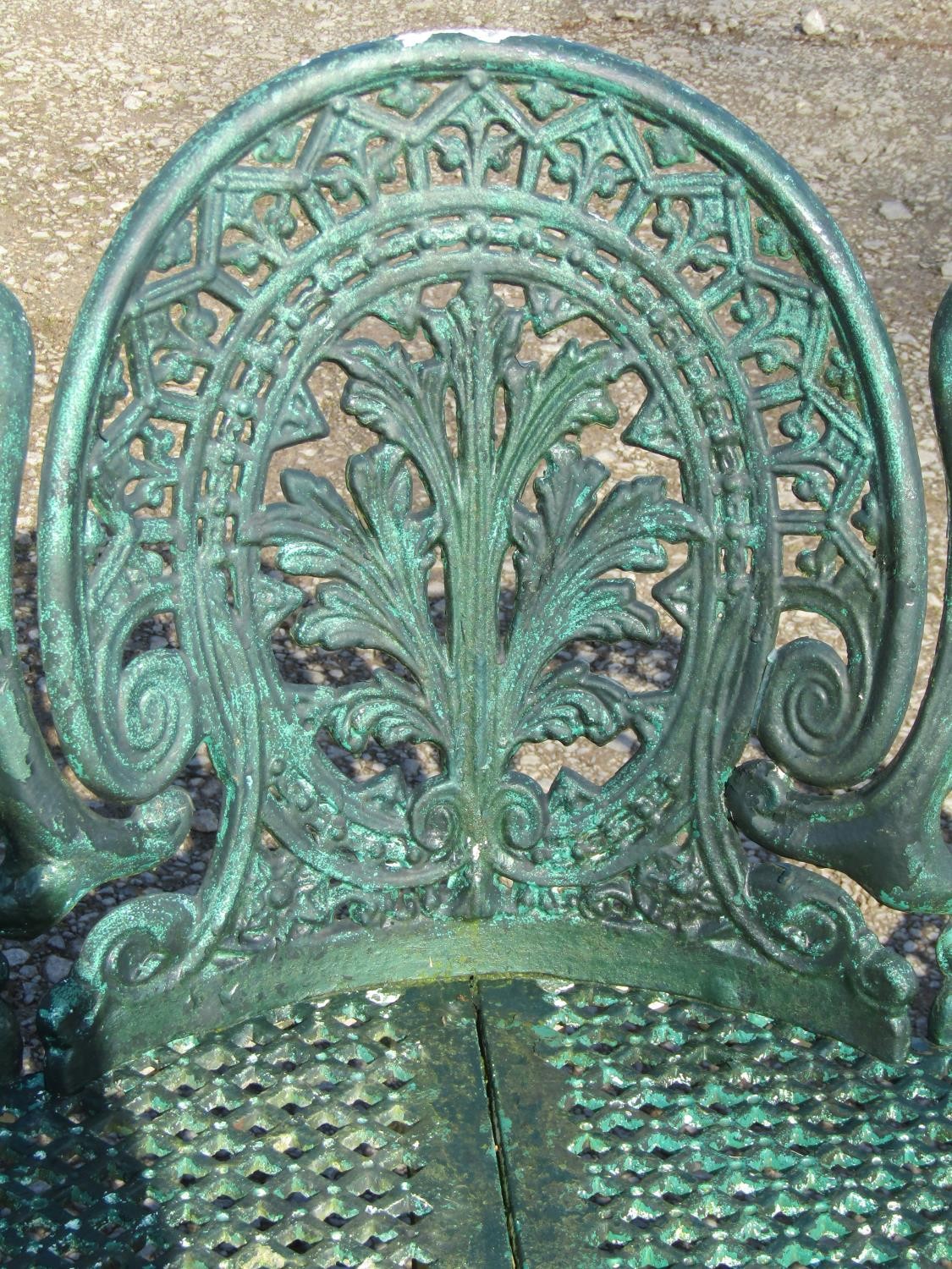 A weathered green painted cast alloy garden bench with shaped outline and decorative pierced - Image 8 of 10