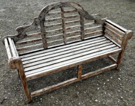 A weathered stained Lutyens style three seat garden bench 166 cm long