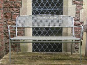A contemporary tubular steel framed two seat garden bench with lattice seat and back, 130 cm long
