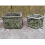 Two medieval style weathered cast composition stone garden planters with relief detail, one of