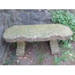 A good weathered cast composition stone crescent shaped bench, 113cm wide x 38cm deep x 46cm high