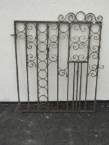 An old weathered ironwork garden gate with scrolling detail, 104cm high, 96cm wide