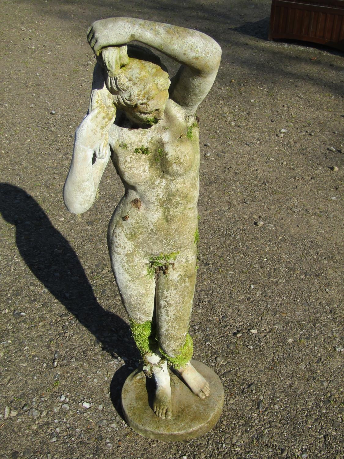 A weathered cast composition stone garden ornament in the form of a standing classical female nude - Image 2 of 7