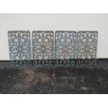 Four rectangular cast iron panels with pierced scrolling foliate detail, 59cm x 35cm