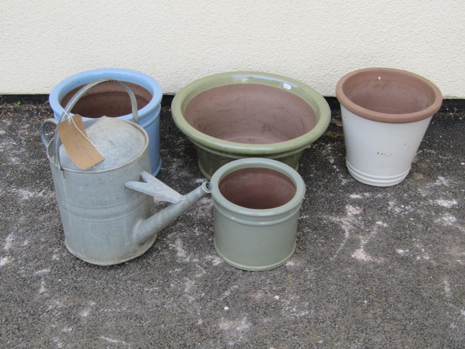 A galvanised iron watering can and four pots of various styles and a bird bath (group)