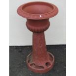 A large moulded terracotta planter jardiniere / planter on stand, the urn with flared egg and dart