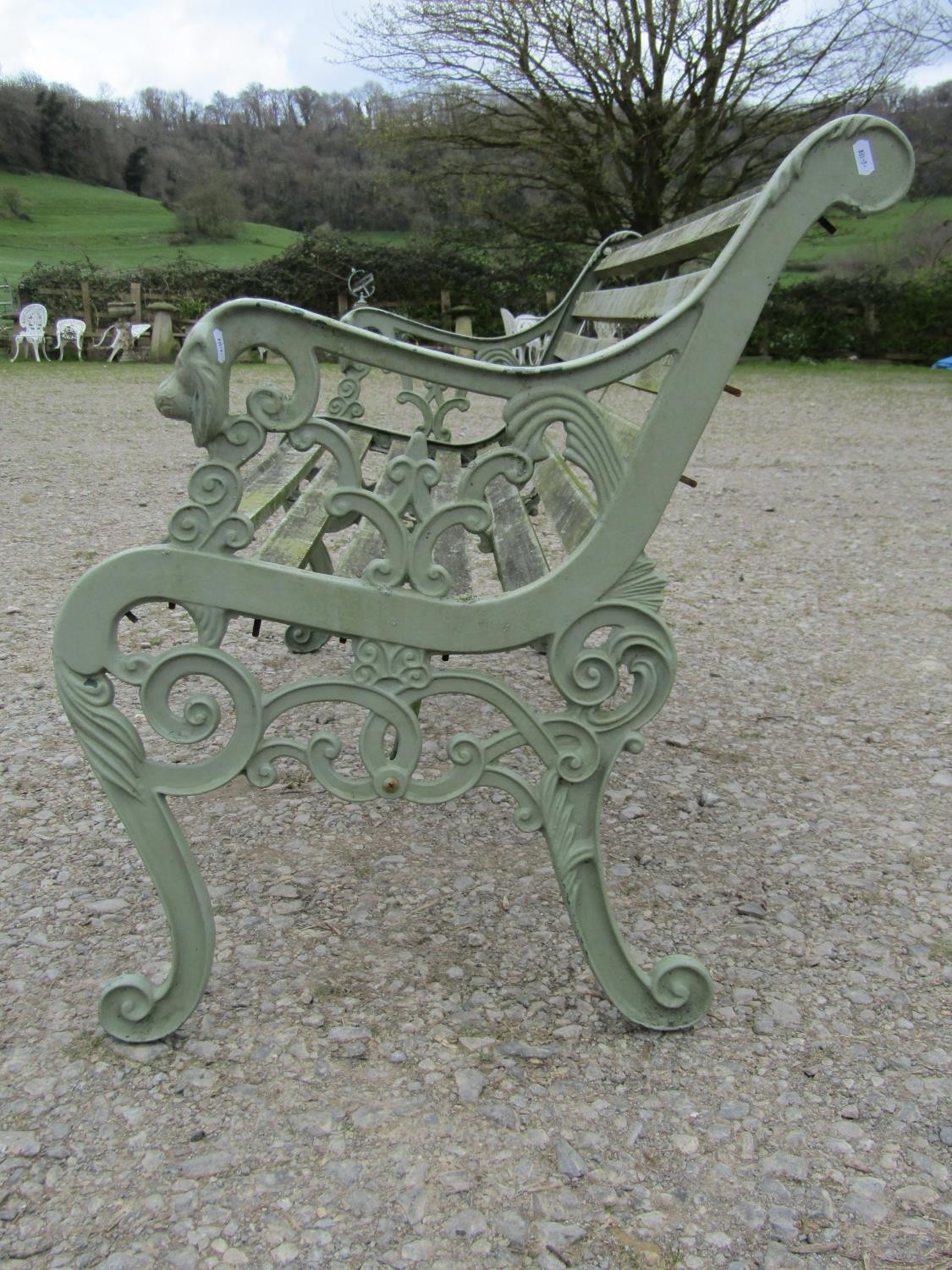 A light green painted garden bench with wooden slatted seat raised on decorative pierced and - Image 2 of 5