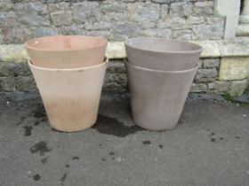 Eight contemporary terracotta planters of circular form (two sizes) the largest 45cm high x 50cm