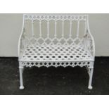 A small cream painted cast alloy two seat garden bench with pierced gothic tracery detail, 87 cm,