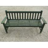 A vintage green painted teak three seat garden bench with slatted seat and back (probably a Lister