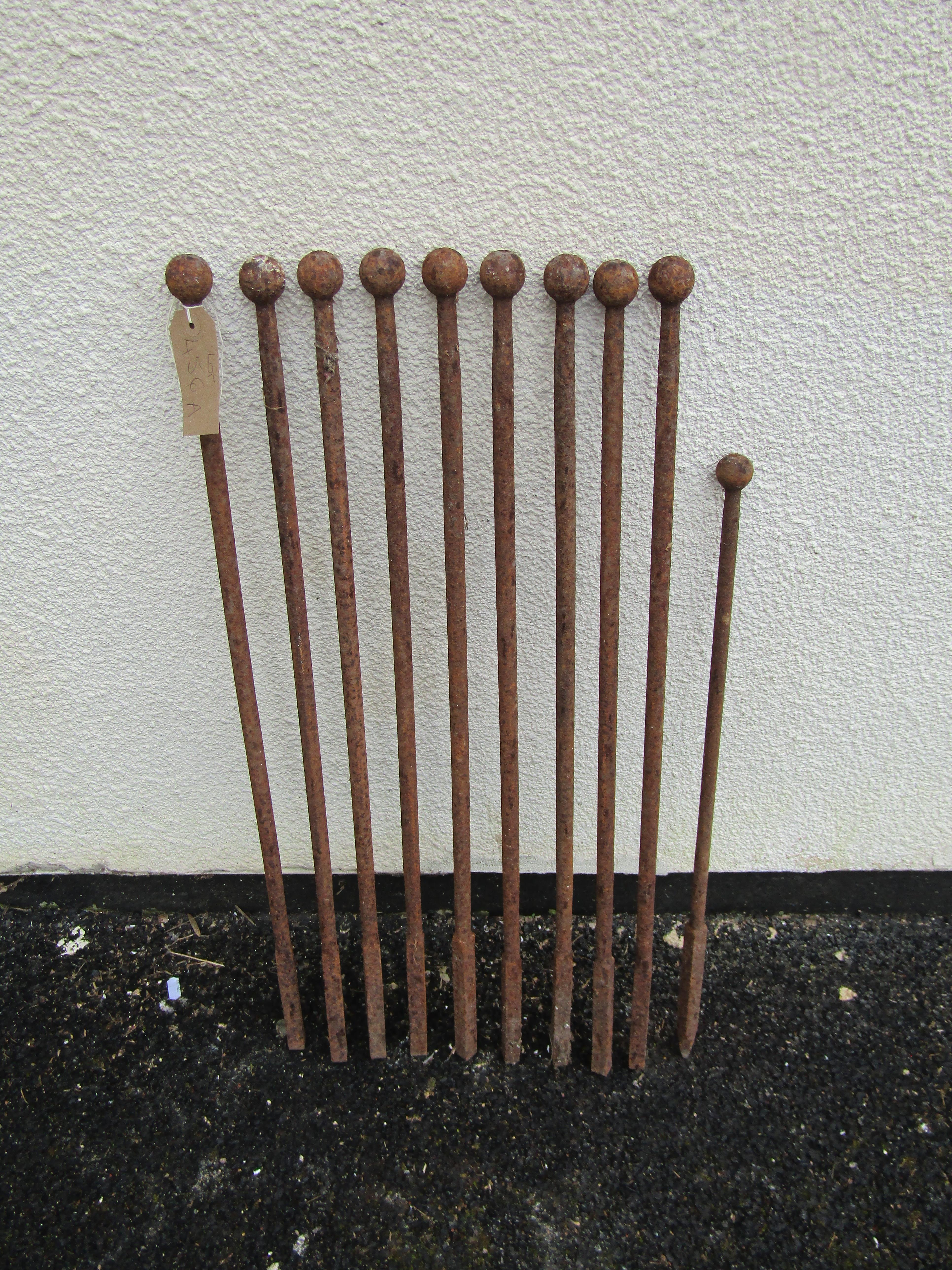 A run of nine antique iron rails/line stakes with ball finials, 77 cm high together with a matching - Image 2 of 3