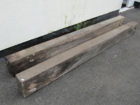 A pair of weathered oak beams with simple chamfered detail, 22 cm high x 239 cm long x 13 cm deep