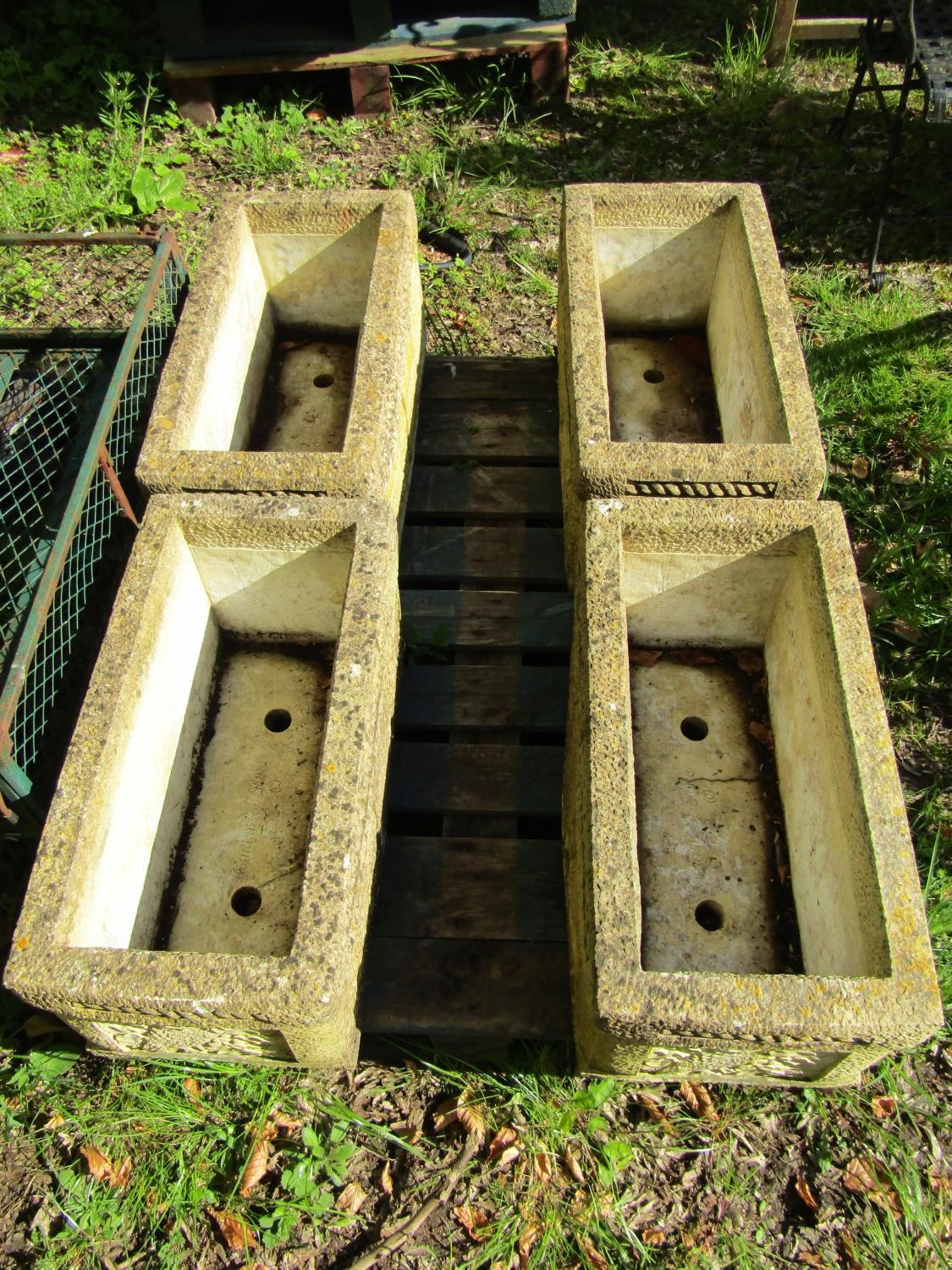 A set of four weathered composition stone garden troughs of rectangular form with repeating owl, - Image 2 of 4