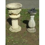 A small weathered cast composition stone garden urn, the circular bowl with flared rim and repeating
