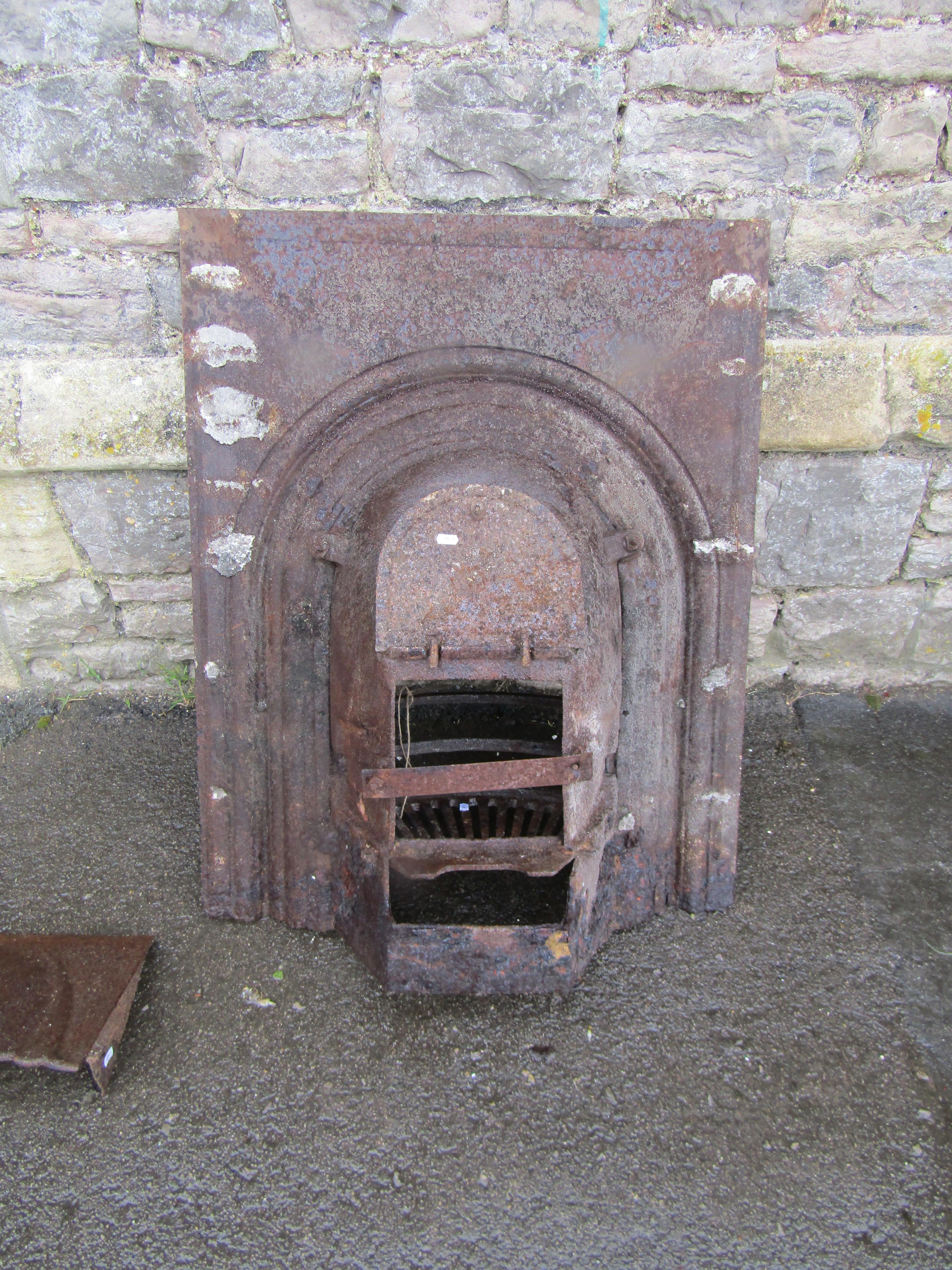 A 19th century cast iron fire insert, the bow fronted basket with arched surround together with - Image 3 of 4