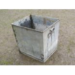A heavy gauge galvanised trough/receptacle of rectangular and tapered form with dropside carrying
