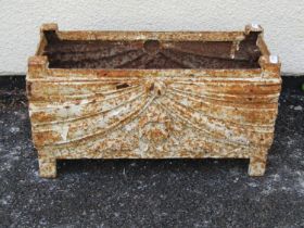 A small decorative rectangular weathered cast iron trough with classical swag detail, 22 cm high x