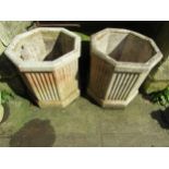 A pair of good quality weathered cast composition stone octagonal fluted planters, 52cm high x