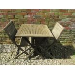 A contemporary wooden three piece folding terrace set with square slatted top table, and a pair of