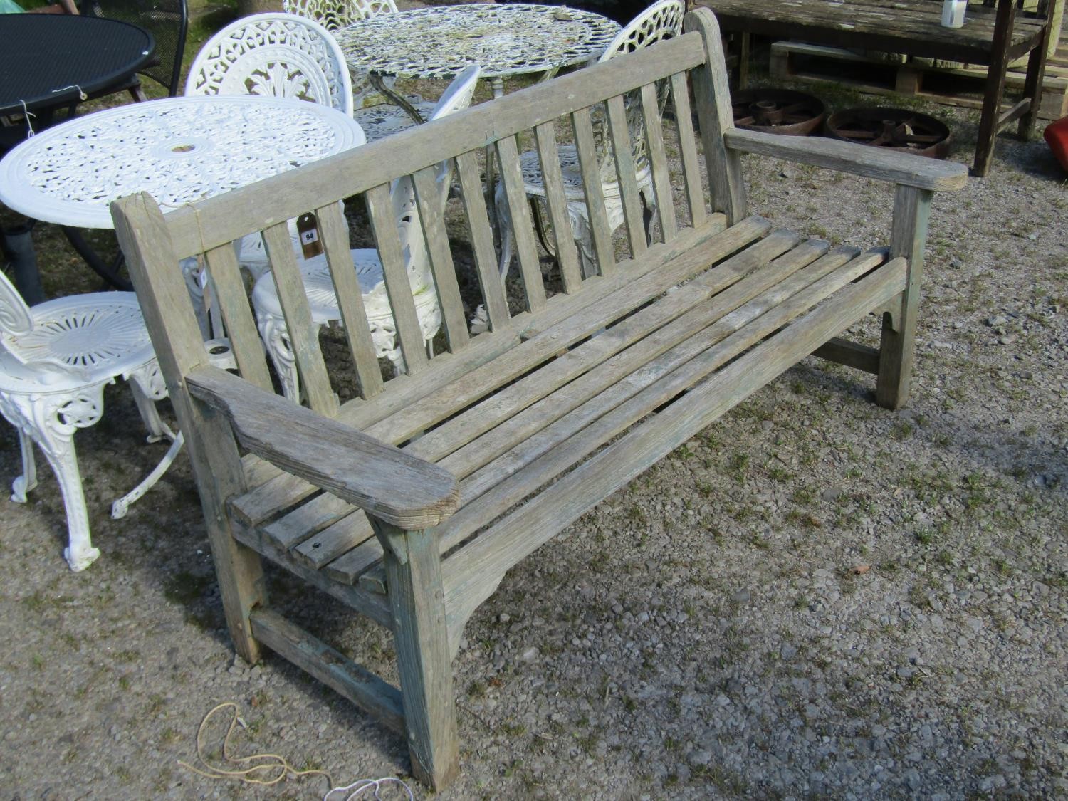 A weathered teak garden bench with slatted seat and back, with traces of painted finish, 162cm - Image 2 of 2