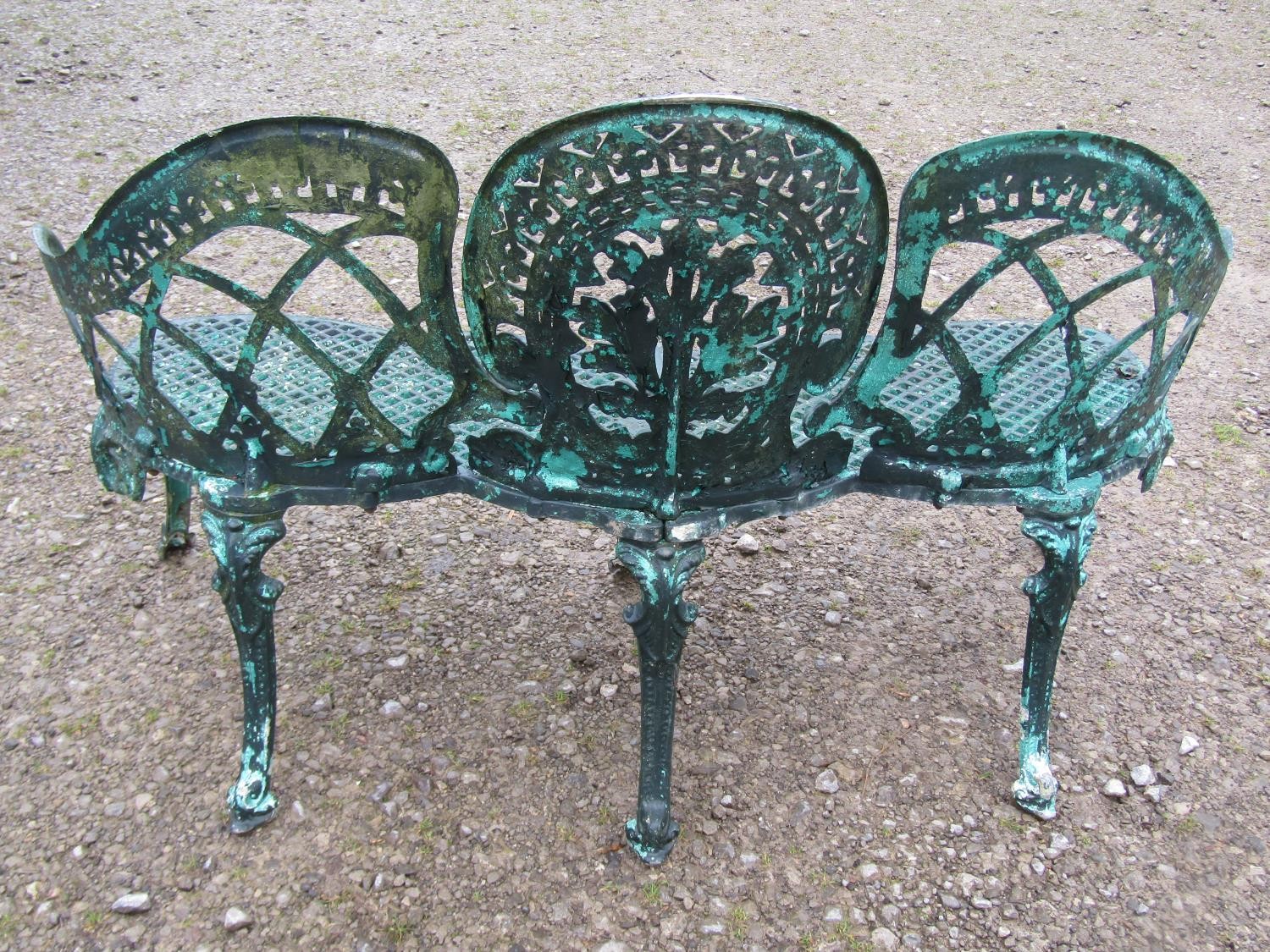 A weathered green painted cast alloy garden bench with shaped outline and decorative pierced - Image 2 of 10