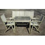 A weathered (silvered) teak garden suite comprising a folding bench with slatted seat and back 141