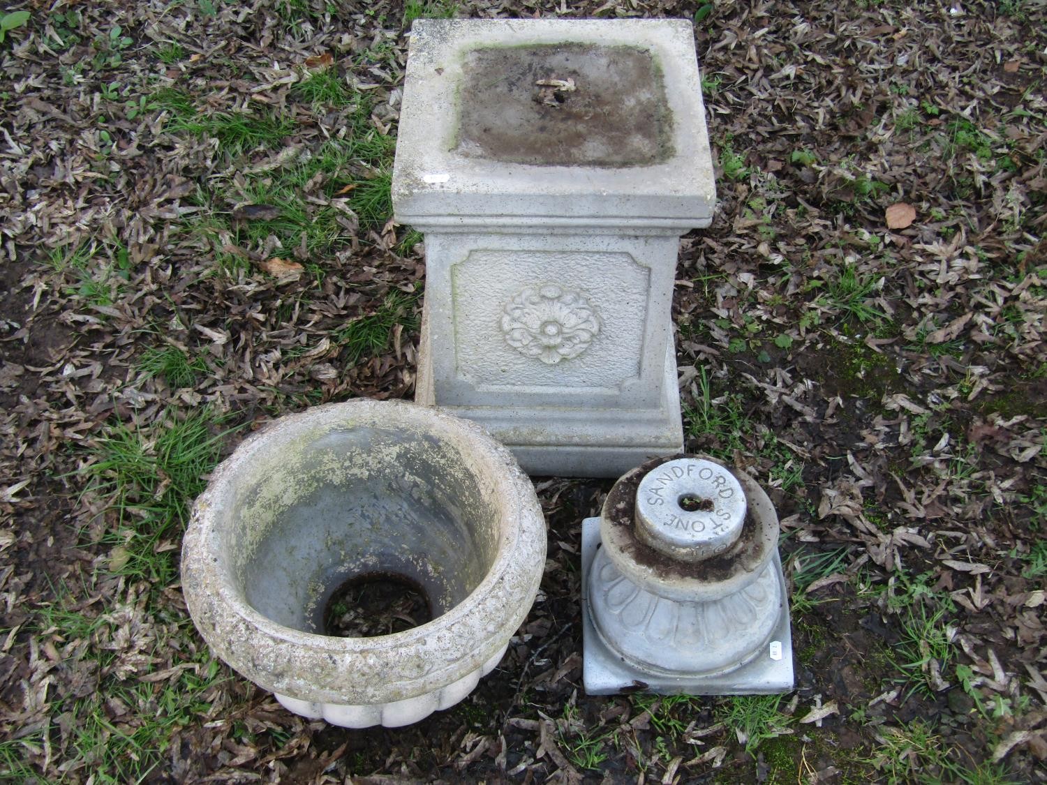 A weathered Sandford Stone cast garden urn with circular lobed bowl raised on a loose socle and - Image 2 of 3