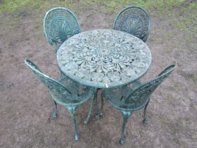 A weathered green painted cast aluminium five piece garden terrace set with decorative pierced and