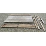 A good quality heavy gauge weathered teak picnic bench of rectangular form with slatted top and side