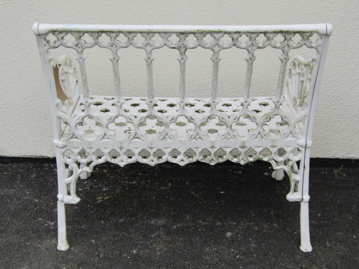 A small cream painted cast alloy two seat garden bench with pierced gothic tracery detail, 87 cm, - Image 3 of 4