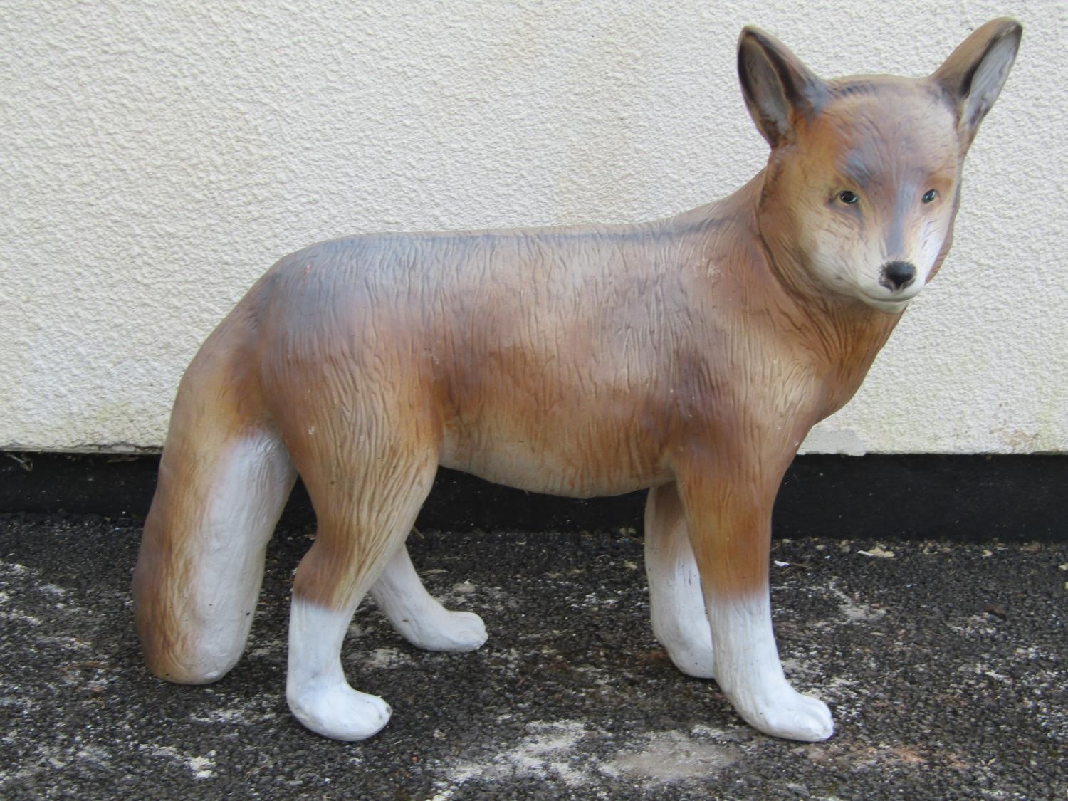 A composite model/ornament in the form of a standing fox 53 cm high x 60 cm long approximately