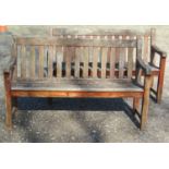 A pair of good quality heavy gauge weathered teak three seat garden benches with slatted seats and
