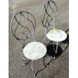 A pair of good quality heavy gauge galvanised steel garden chairs with oval pierced lattice backs,