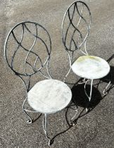 A pair of good quality heavy gauge galvanised steel garden chairs with oval pierced lattice backs,