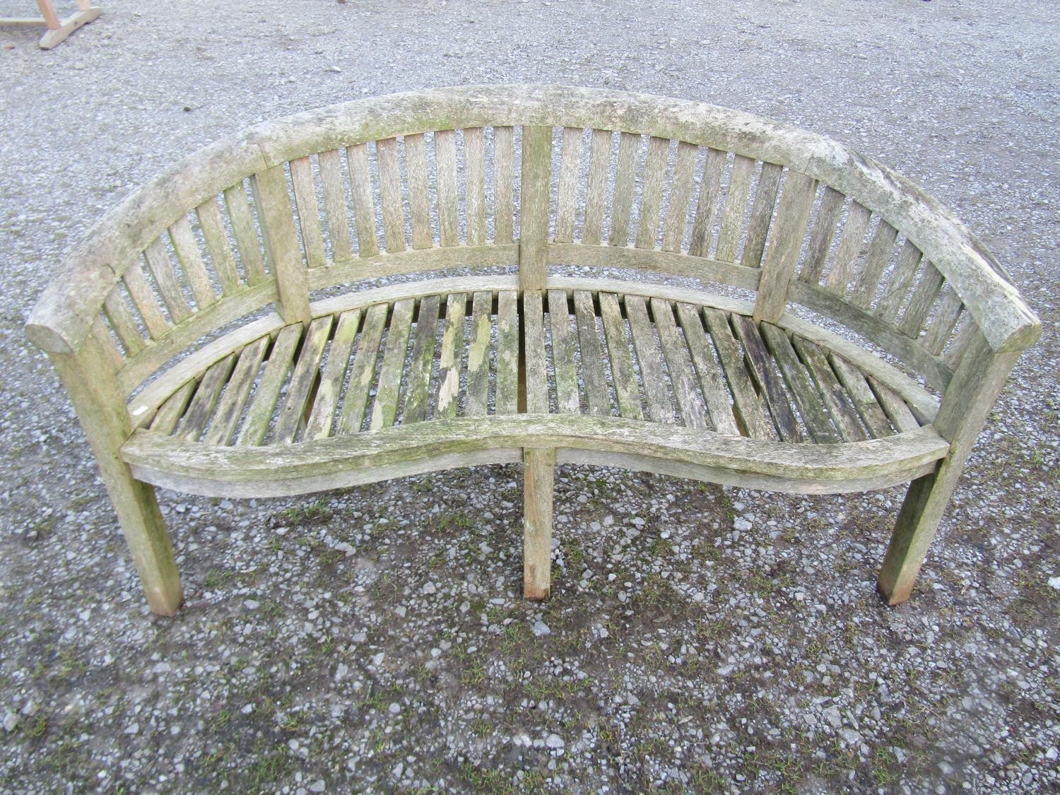A pair of weathered teak banana shaped garden benches 160 cm wide - Image 2 of 7
