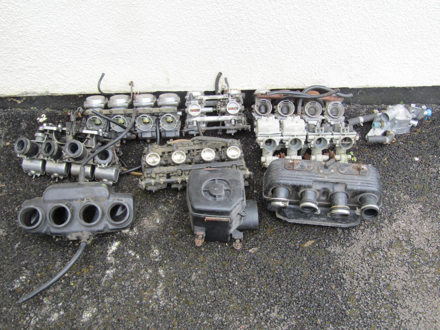 A collection of assorted motorcycle carburettors