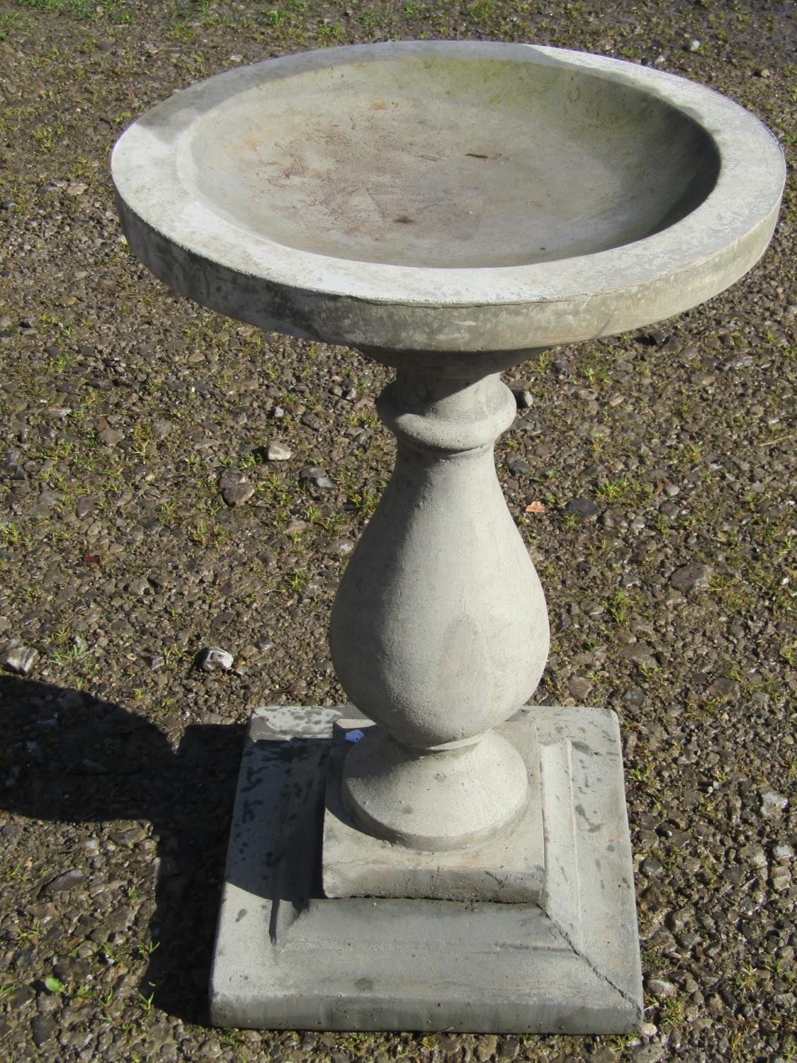 A cast composition stone three sectional bird bath of circular form raised on a baluster pedestal - Image 2 of 3