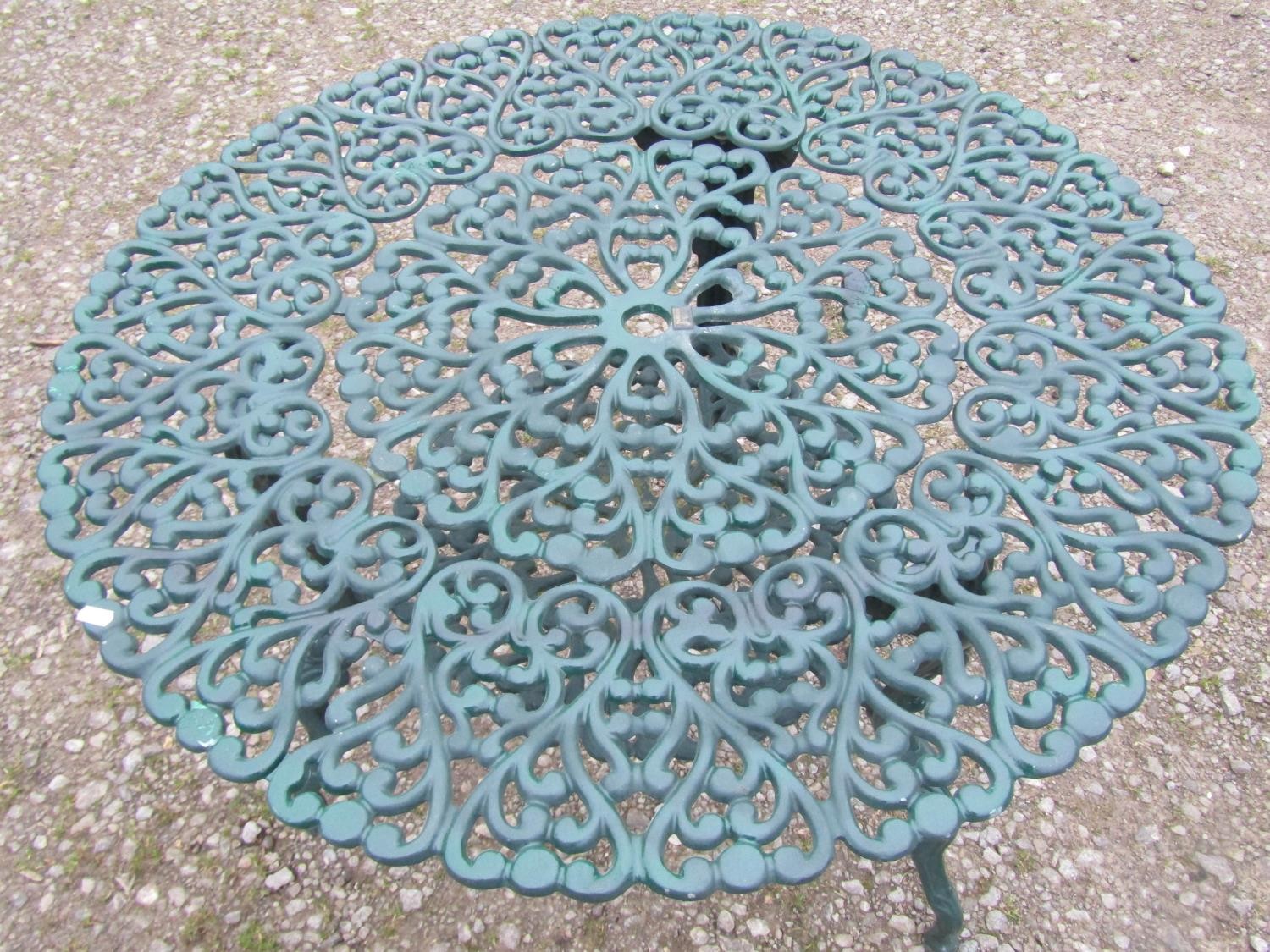 A green painted cast alloy circular two tier garden terrace table, with decorative repeating 'c' - Image 7 of 7