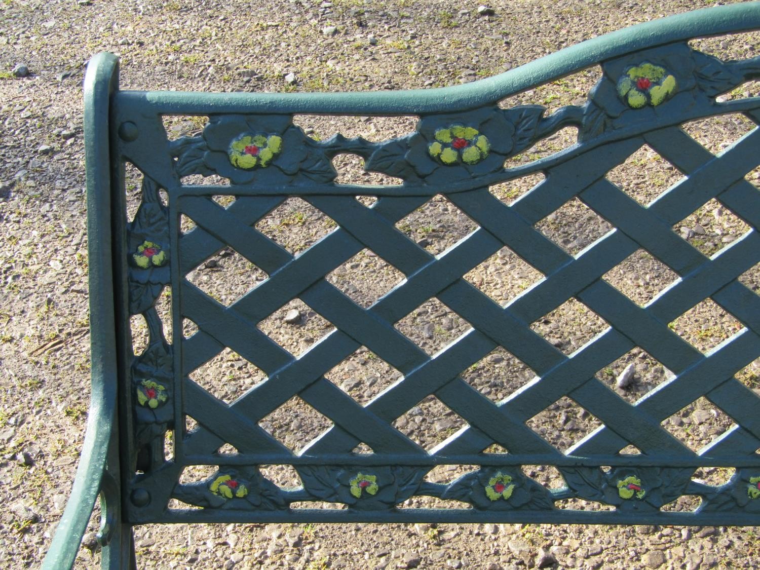 A green painted garden bench with wooden slatted seat beneath a cast iron pierced lattice panelled - Image 5 of 6