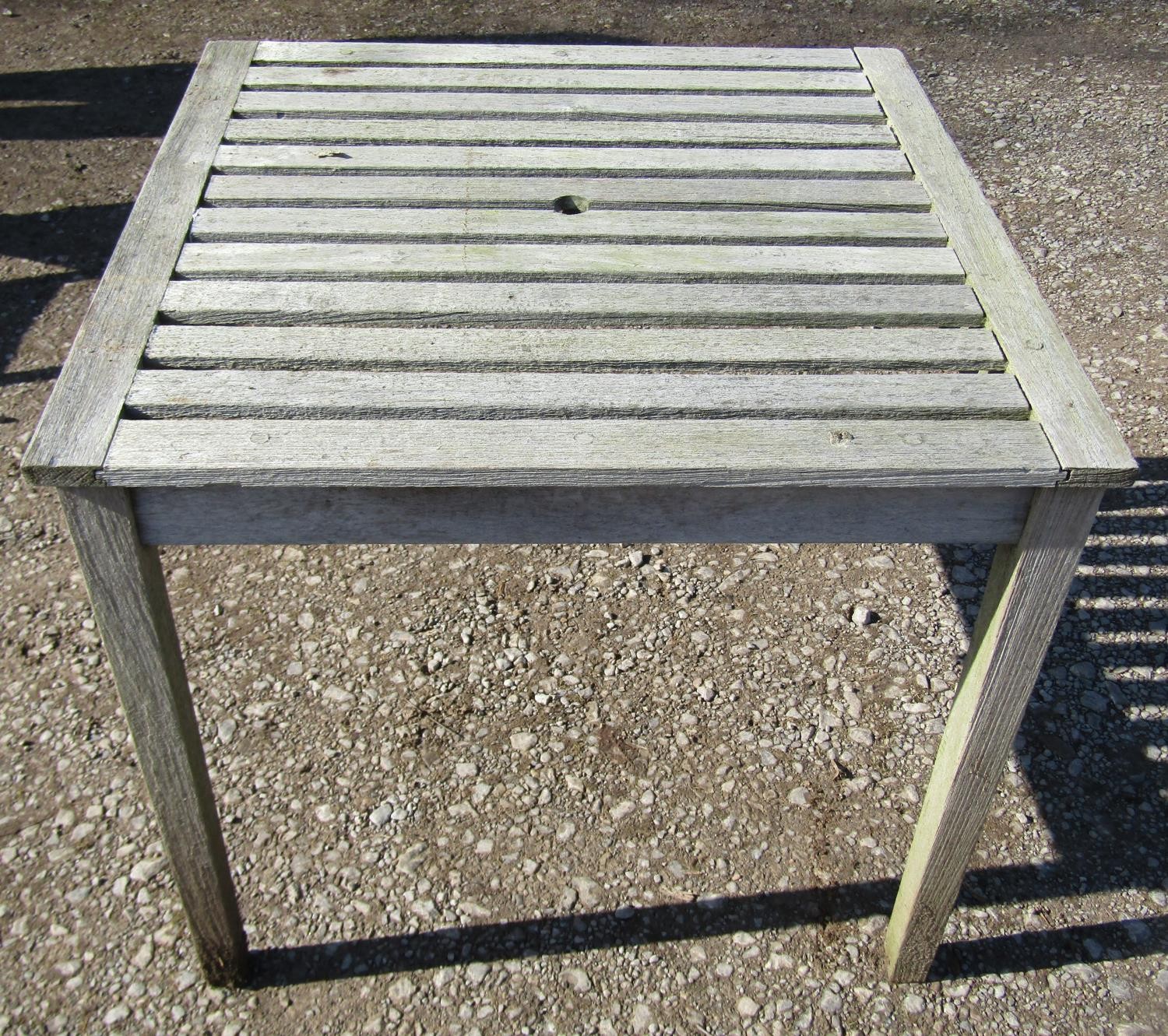 A weathered (silvered) teak garden suite comprising a folding bench with slatted seat and back 141 - Image 2 of 6