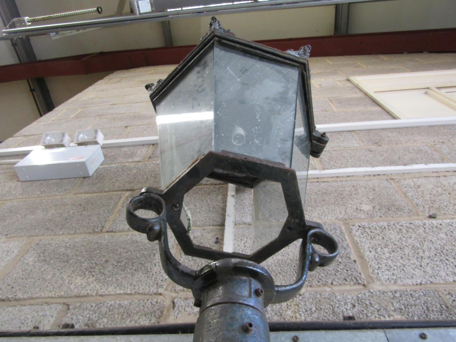 A Victorian style cast iron lamp post with hexagonal tapered hood raised on a partially fluted - Image 5 of 5