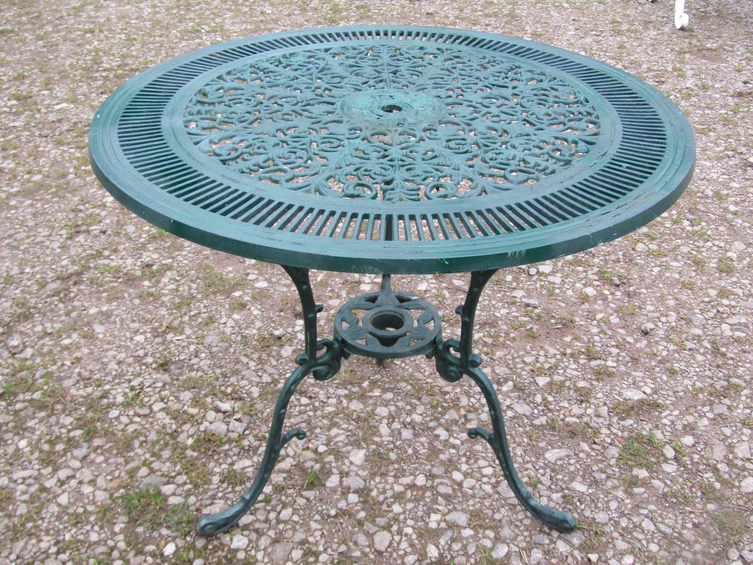 A green painted cast aluminium garden terrace table of circular form, with decorative pierced top, - Image 5 of 6