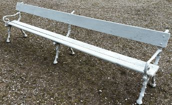 A long park/railway waiting bench with painted finish, wooden slatted seat and back rail raised on
