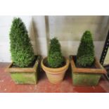 A pair of weathered terracotta square cut garden planters with stepped and moulded rims and