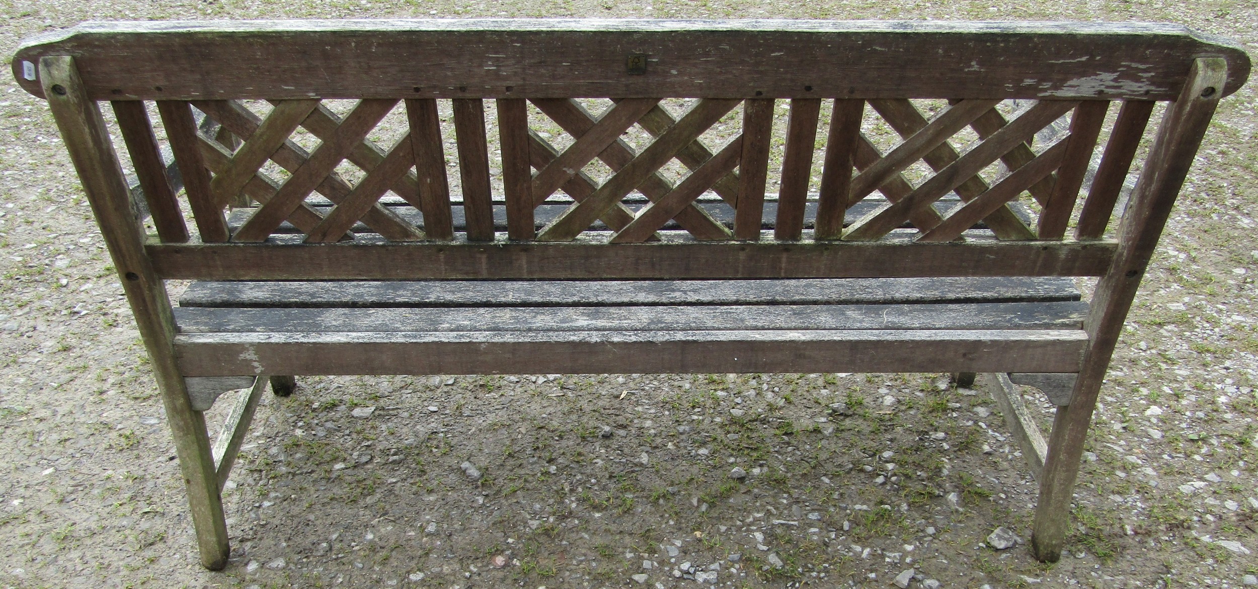 A weathered three seat garden bench with slatted seat and lattice panelled back beneath a shaped - Image 3 of 5